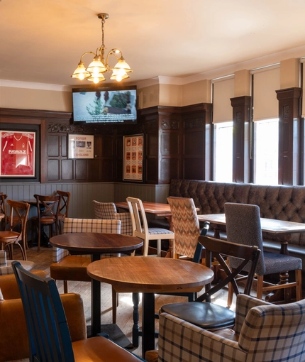 interior of the restaurant and seating area with TV