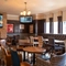 interior of the restaurant and seating area with TV