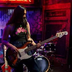 An interior shot of a person playing the guitar during the Q3 Live Music Event at one of the Greene King Pubs.