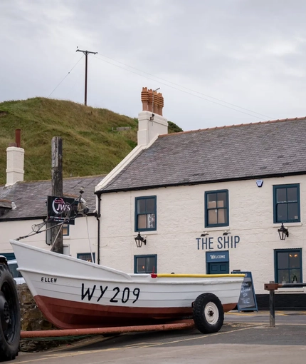 Exterior facade with a boat infront of the venue