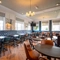 The interior restaurant and seating area with TV at the Black Horse.