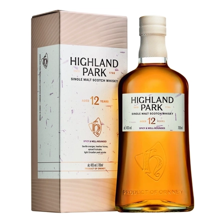 A bottle of Highland Park 12 year old single malt Scotch whisky, standing next to it's presentation box. 