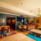 The bar and interior restaurant seating area at The Windmill Inn in York, with upholstered bench seats, TVs on the wall, and a fireplace.