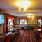 interior dining area of a pub with a TV