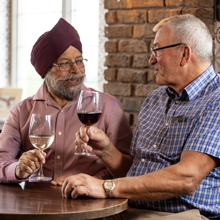 Two men enjoying drinks in a PK pub
