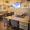 Interior dining area of a pub with a TV.