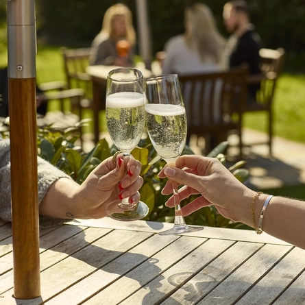 An image showing two glasses of Prosecco being enjoyed at Chef & Brewer.