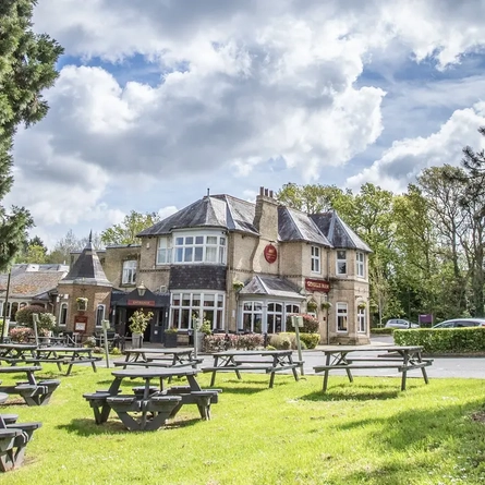 External beer garden of a pub with a seating area.