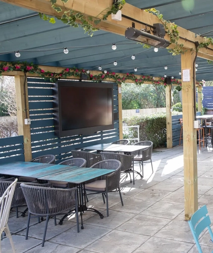 exterior beer garden with seating area