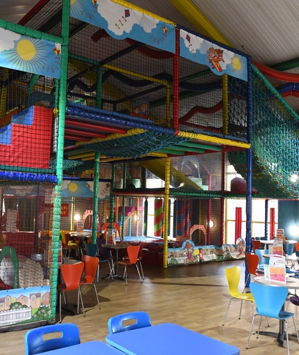 Interior kids dining and play area of a pub.