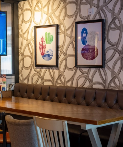 The interior restaurant and seating area with Tv at the Lutley Oak.