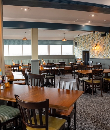 The interior restaurant and seating area with TV at the Dragon.