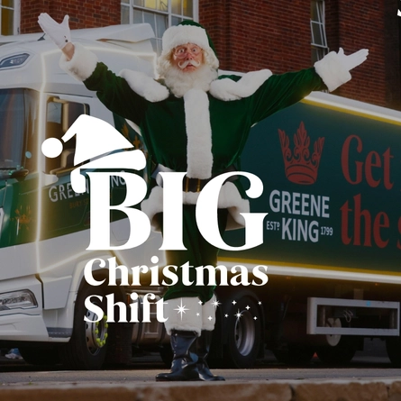 A banner showing the words "Big Christmas Shift" on top of an image of Santa Claus standing in front of a  Greene King truck with both of his arms raised up.