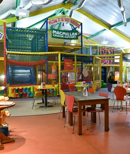 Interior play area of a pub with a dining area.