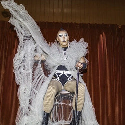 An image of Anna Toni stood on the interior live event stage at The City Of Quebec.