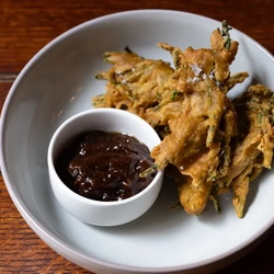 Samphire pakoras with a pot of date and tamarind chutney