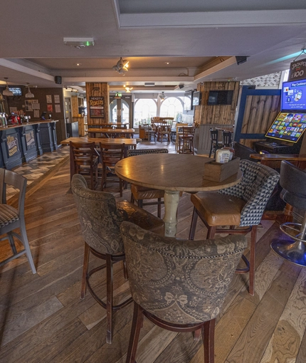 interior restaurant and seating area with pub games