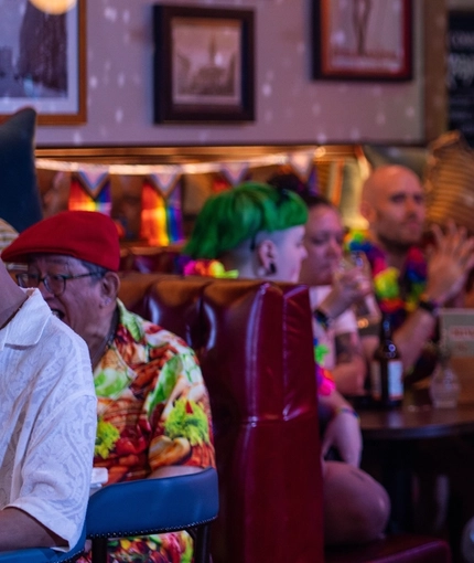 An interior image of one of the drag queen performers entertaining crowds during Pride Weekend at The City Of Quebec.