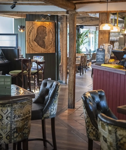 Interior image of the seating area and the bar