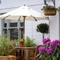 A table with an umbrella in the beer garden of the Grapes.