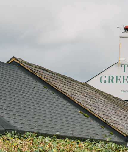 The exterior facade and signage of The Green Man in Brackley Hatch.
