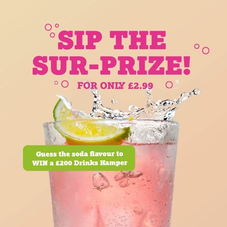 A banner showing a piece of lime falling into a pink coloured drink to advertise a Mystery Soda competition with a chance to win a drinks hamper at Farmhouse Kitchen venues.