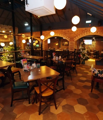Interior dining area with tables and chairs.