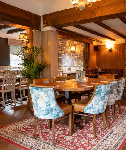 The interior restaurant and seating area with fireplace at the Crown Inn.
