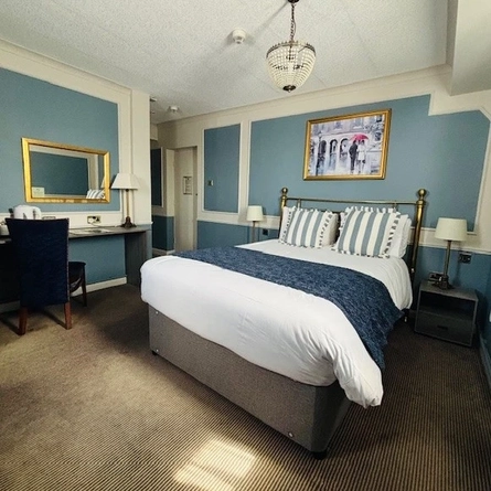 A double bed in bedroom 12 at the Coleshill Hotel.