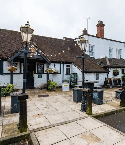 Exterior shot of the pubs facade and beer garden