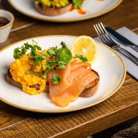A plated Smoked Salmon dish at Crafted venues.
