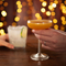 a man and a woman holding cocktails