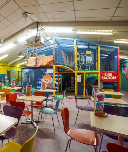 Interior play area and dining area of a pub.