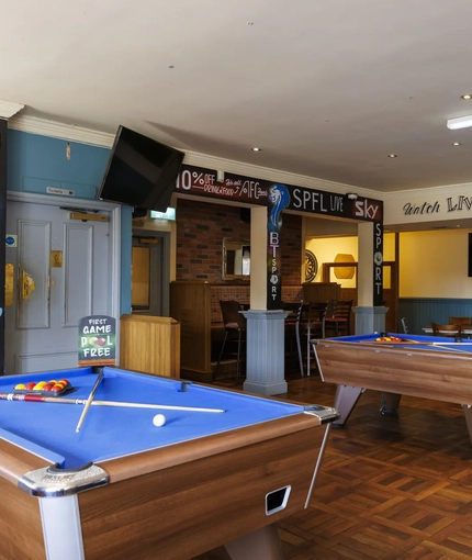 Interior shot of the pool tables and seating area