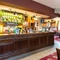 Interior dining area of a pub with a bar.