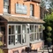 External view of a pub with outdoor seating area