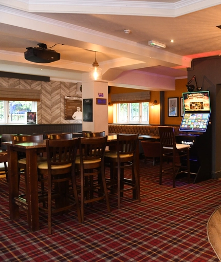 interior restaurant and seating area with pub games