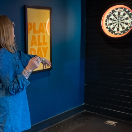 A person playing darts at Hightales