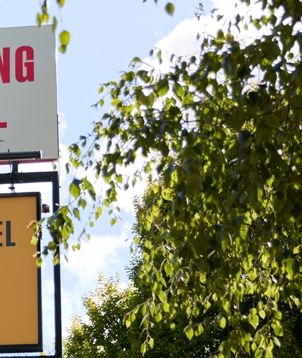 A close up view of the exterior sign of The Carousel.