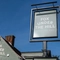 A close up of the signage outside of a pub
