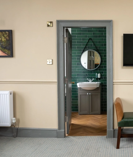 The door to the bathroom in a hotel room at Himley House.