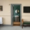 The door to the bathroom in a hotel room at Himley House.