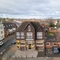 An aerial view of the exterior facade, signage, and car park of the Green Posts in Portsmouth.