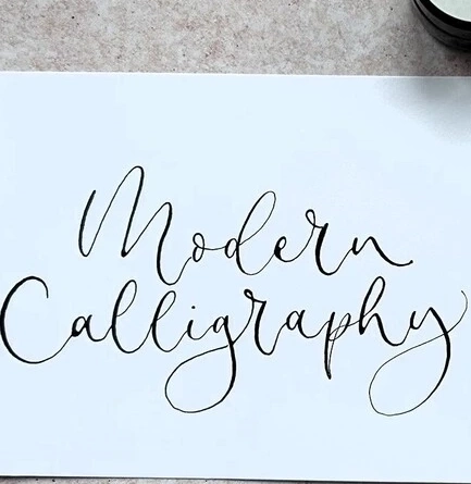 An image of calligraphy writing and pen advertising a Calligraphy Workshop What's On event at The Cart & Horses.