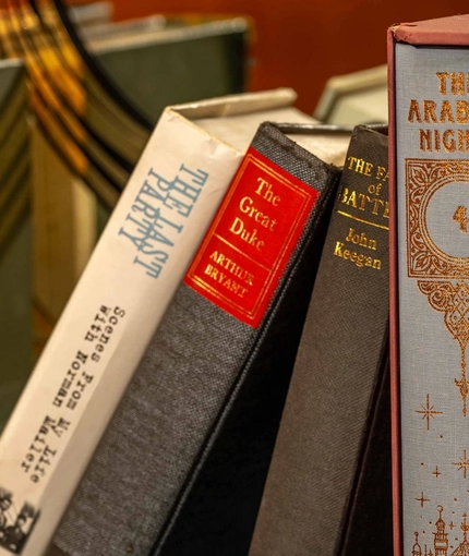 A close up image focusing on a collection of books sat on a shelf at The Lucas Arms.