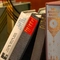 A close up image focusing on a collection of books sat on a shelf at The Lucas Arms.