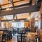 The interior restaurant seating area with fireplace and TV at The Belfry in Beighton.