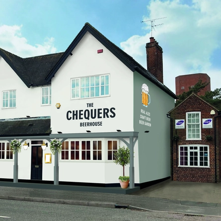 The exterior facade with outdoor seating area at The Chequers.