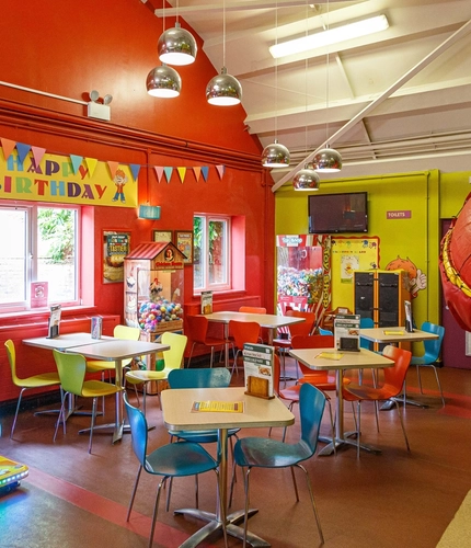 Interior play area of a pub with a dining area.