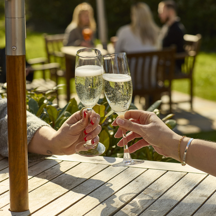 An image showing two glasses of Prosecco being enjoyed at Chef & Brewer.